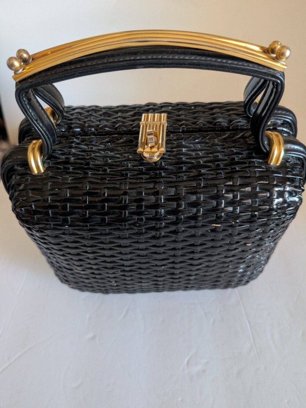 GLADYS GOLDEN, QUEEN OF STRAW, BLACK WOVEN PURSE WITH METAL TRIM